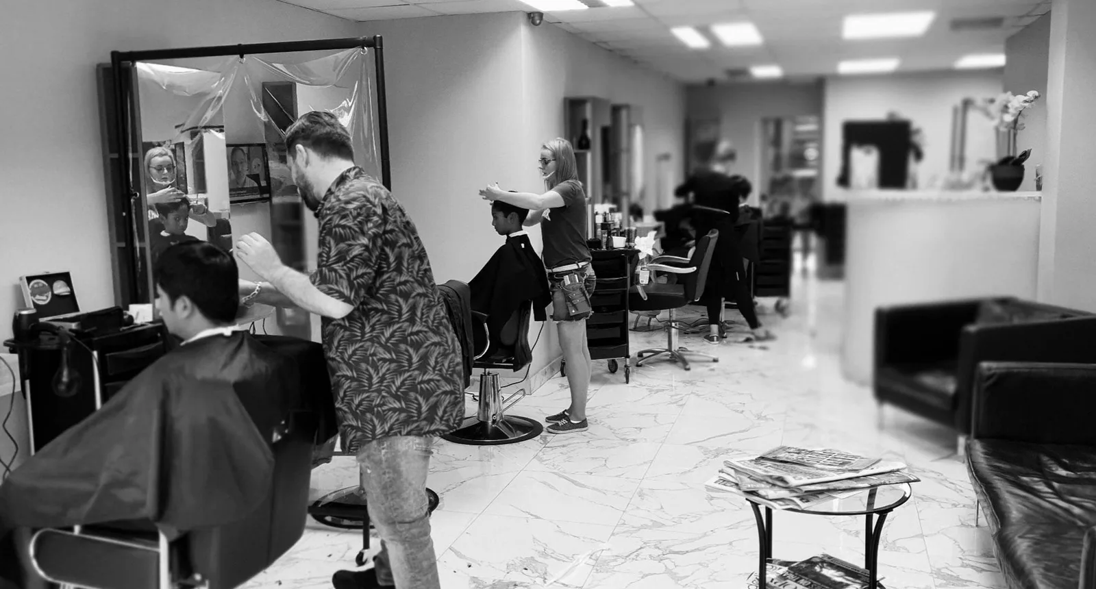Stylist working with a client inside the salon